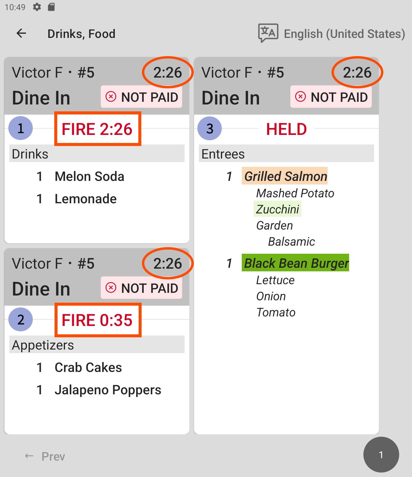 A prep station KDS device with three course tickets for a single order, with two courses fired and the third held.